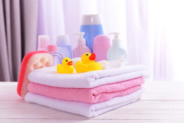 Baby accessories for bathing on table on light background — Stock Photo, Image