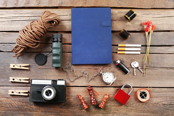 Hiking gear on wooden background — Stock Photo, Image