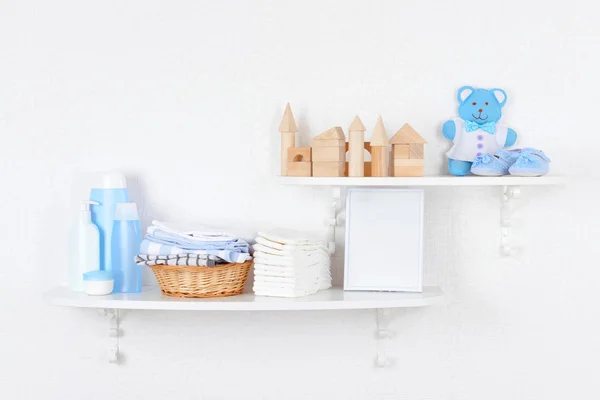 Baby accessories on shelves — Stock Photo, Image