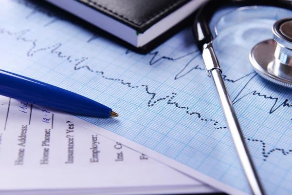 Cardiogram with stethoscope on table, closeup — Stock Photo, Image