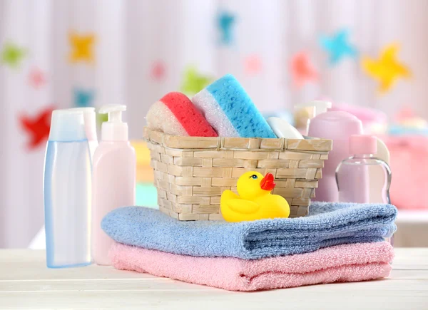 Baby accessories for bathing on table on light background — Stock Photo, Image