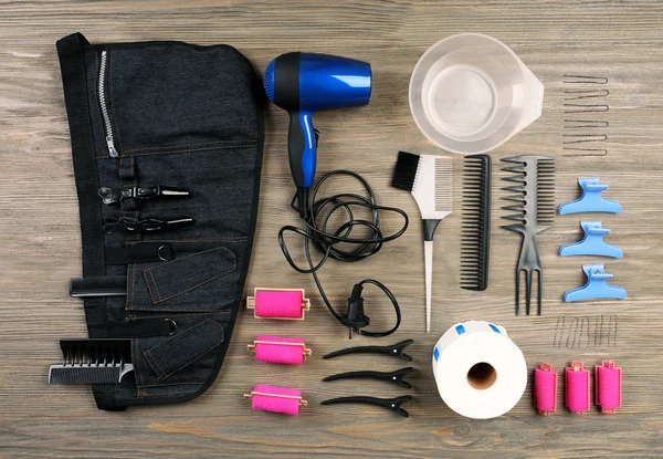 Hairdressing tools on wooden background — Stock Photo, Image