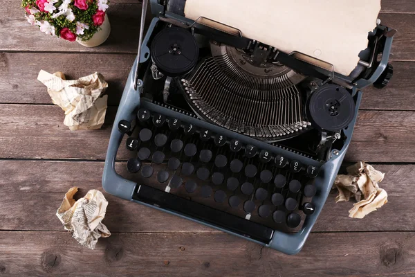 Retro typewriter on wooden table, top view — Stock Photo, Image