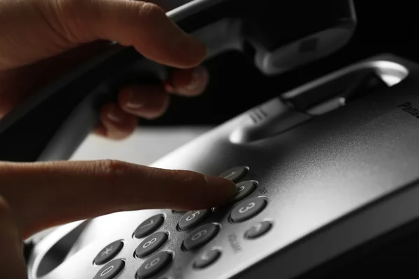 Finger pressing number button on telephone to make a call, close up — Stock Photo, Image