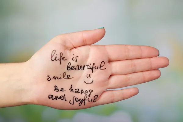 Female hand with written message — Stock Photo, Image