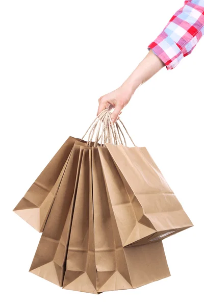 Female hand holding paper shopping bag isolated on white — Stock Photo, Image