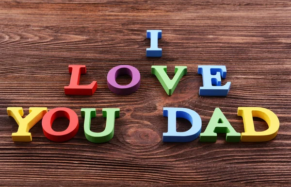 Ja miłość ty tata wykonane z kolorowych liter na drewnianym tle napis — Zdjęcie stockowe