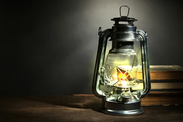 Kerosene lamp and letters on dark grey background — Stock Photo, Image