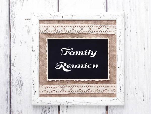 Wooden frame with old photo on wooden background — Stock Photo, Image