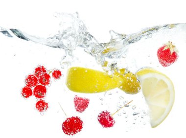 Fresh fruits and berries splashing in water isolated on white clipart