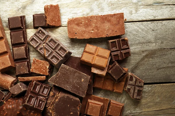 Set of chocolate on wooden table — Stock Photo, Image