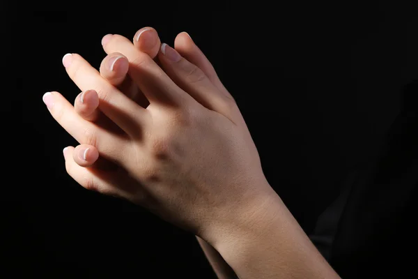 Woman praying in darkness — Stock Photo, Image