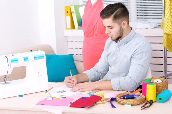 Young man fashion designer creates new collection of clothes — Stock Photo, Image