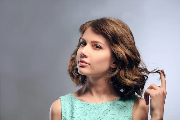 Portrait of beautiful model on gray background — Stock Photo, Image