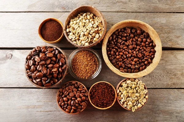 Various of coffee in small dishes on wooden table, top view — Stock Photo, Image