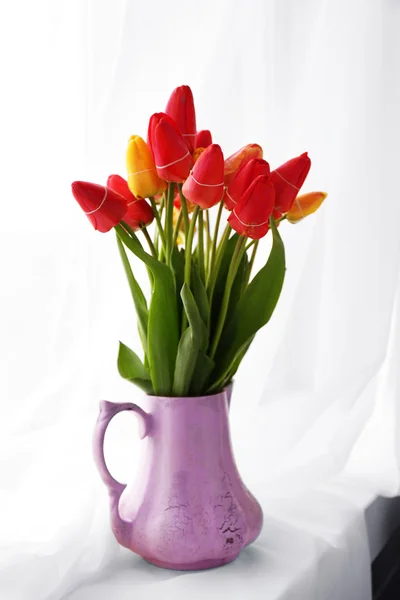 Bouquet of fresh tulips on windowsill background — Stock Photo, Image