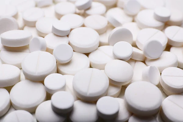 Pile of white pills, closeup — Stock Photo, Image