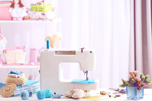 Sewing machine on table in workshop
