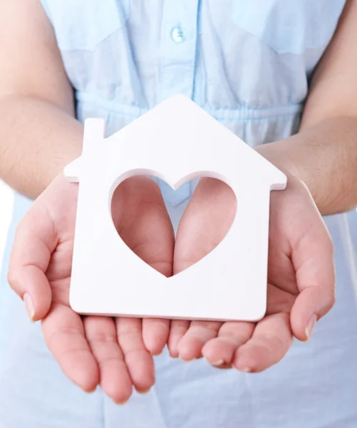 Female hands with small model of house, closeup — Stock Photo, Image