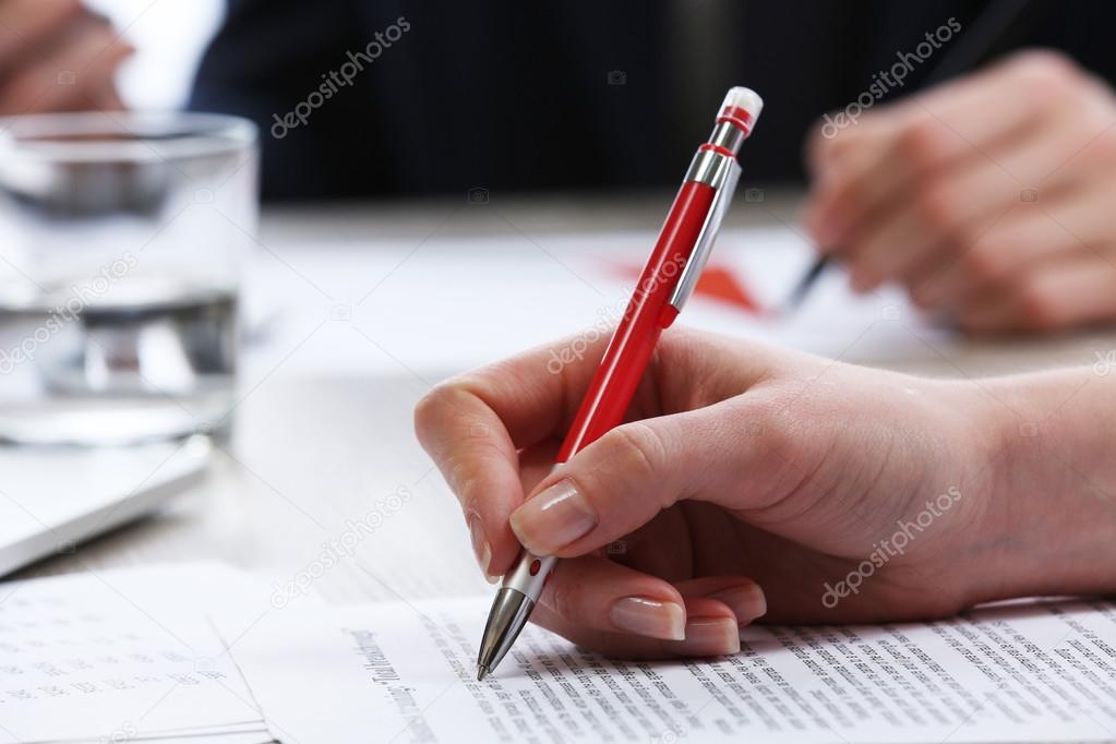 Signing of documents at worktable