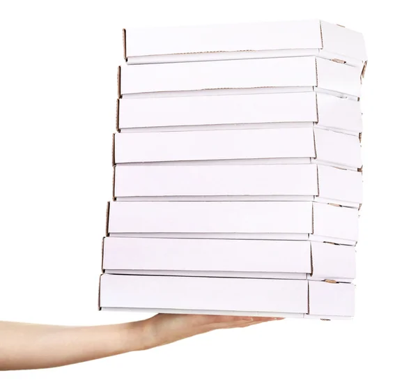 Mão segurando caixas de pizza isoladas em branco — Fotografia de Stock