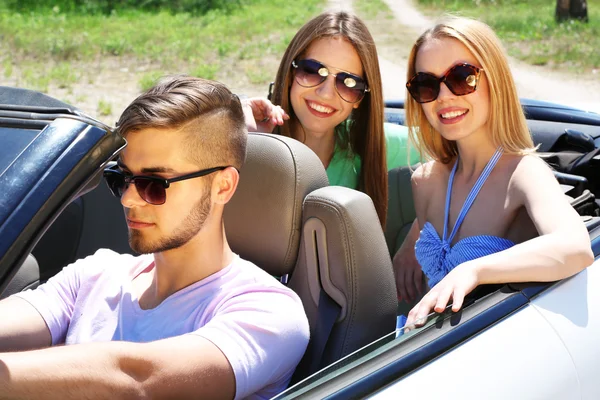 Three friends in cabriolet, outdoors — Stock Photo, Image