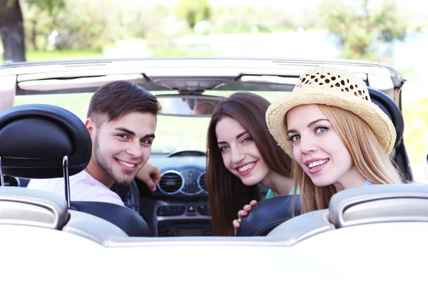 Three friends in cabriolet, outdoors — Stock Photo, Image