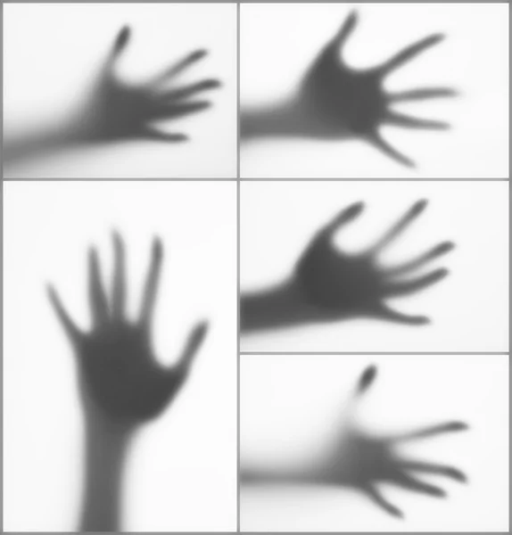 Collage of hands silhouettes behind glass foreground