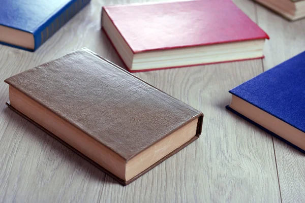 Heap of books on wooden background — Stock Photo, Image