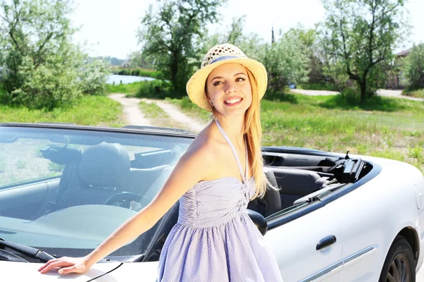 Pretty girl standing near cabriolet, outdoors — Stock Photo, Image