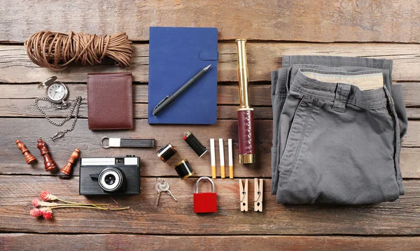 Hiking gear on wooden background — Stock Photo, Image