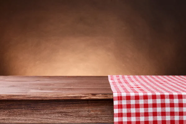 Empty wooden table with napkin