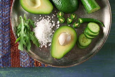 Sliced avocado, cucumber and pepper