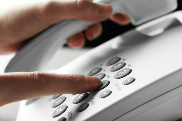 Finger pressing number button on telephone to make a call, close up — Stock Photo, Image