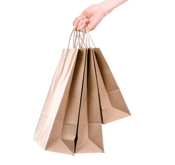 Female hand holding paper shopping bag isolated on white — Stock Photo, Image