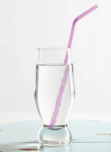 Glass of water on table on light background — Stock Photo, Image