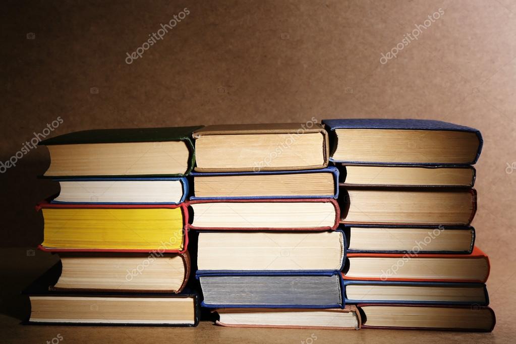 Old books on shelf, closeup, on wooden background Stock Photo by