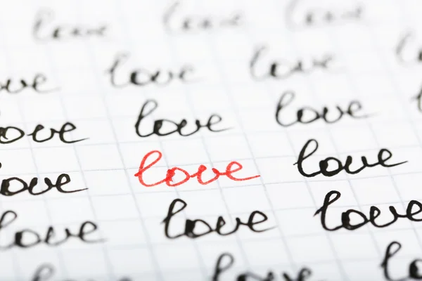 Parole LOVE scritte su foglio di sfondo di carta — Foto Stock