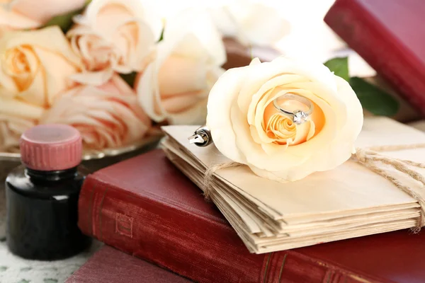 Fresh roses with old book