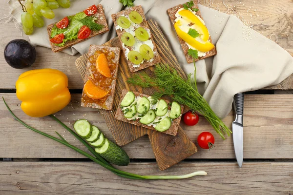 Still life with vegetarian sandwiches on wooden table — Stock Photo, Image