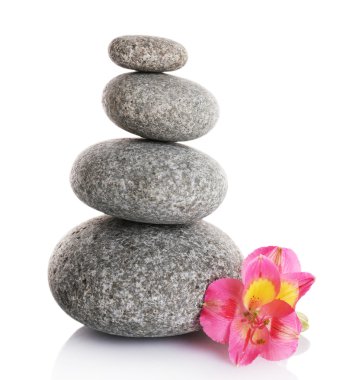 Stack of spa stones with pink flower