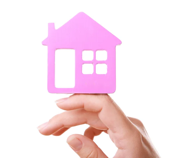 Vrouwelijke hand met kleine model van huis geïsoleerd op wit — Stockfoto