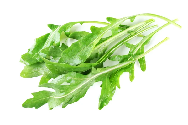 Foglie di rucola verde isolate su bianco — Foto Stock