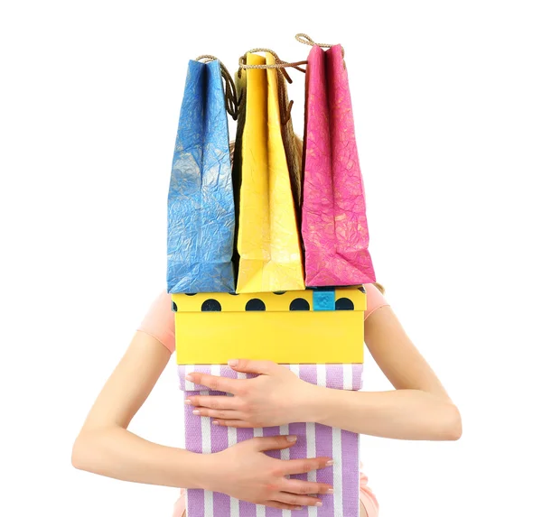 Belle jeune femme avec des sacs à provisions et des boîtes isolées sur blanc — Photo