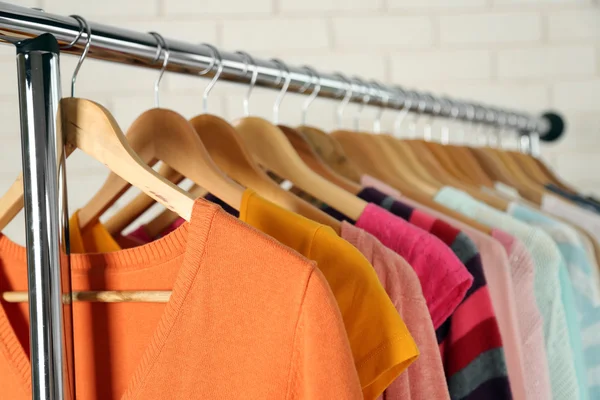 Different clothes on hangers — Stock Photo, Image