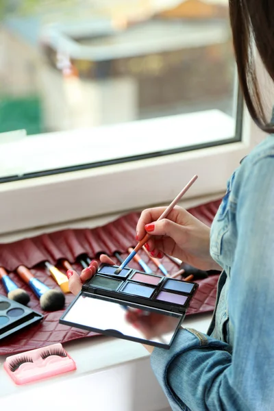 stock image Female makeup artist with cosmetics at work close-up