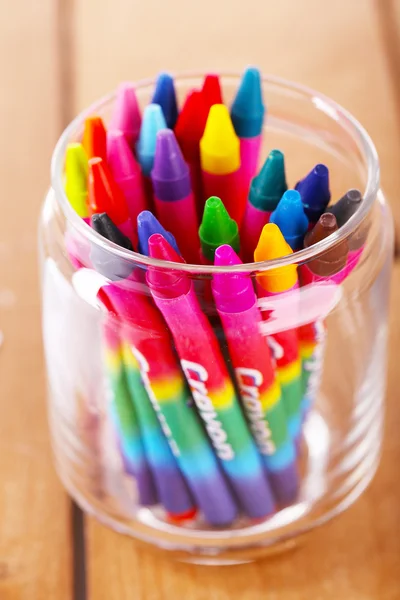 Colorful pastel crayons in glass holder, closeup — Stock Photo, Image