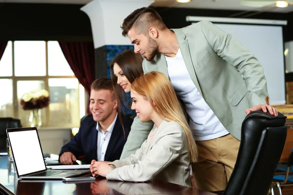 Businesswoman and business people working at notebook in conference room — Stock Photo, Image