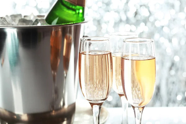 Glasses of champagne on bright background — Stock Photo, Image