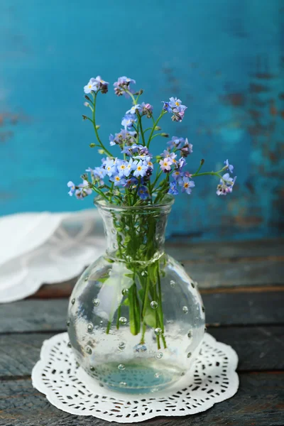 Composition with Forget-me-nots flowers on wooden background — Stock Photo, Image